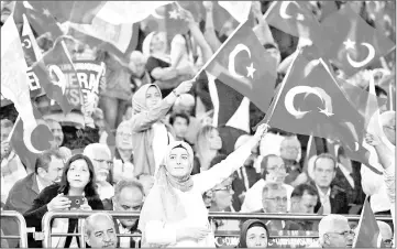  ??  ?? Supporters of Aksener hold Turkish flags during an election campaign meeting in Ankara. — AFP photo