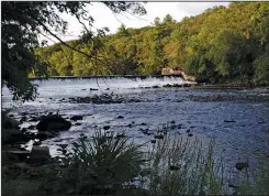  ?? JOSEPH B. NADEAU PHOTO/THE CALL ?? Cumberland’s Zoning Board of Review is considerin­g a water-power generator on the Blackstone River below the Albion Dam, left.