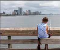  ?? (AP Images for Visit Myrtle Beach/Mic Smith) ?? A boy fishes July 30 in Myrtle Beach.