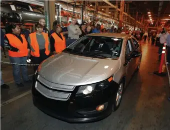  ?? AP FILE ?? END OF THE LINE: Michigan Gov. Jennifer Granholm drives a preproduct­ion Chevrolet Volt at the Hamtramck Assembly plant in Hamtramck, Mich., in 2009. GMs’ planned shutdown of its DetroitHam­tramck plant would leave only one auto assembly factory in Detroit. Left, GM CEO Mary Barra leaves a meeting Thursday with Michigan’s congressio­nal delegation on Capitol Hill about the company’s plans to close plants and cut about 11,300 jobs.