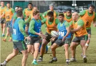  ?? AFP file ?? Australian rugby players play during a training session in Sydney. —