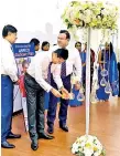  ??  ?? Arpico Insurance PLC CEO Harsha De Alwis (L) conversing with General Manager- Sales H E T Sampath while N C P Nishan, GMSales lights the oil lamp at the Diabcare launch