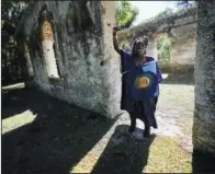  ?? ?? Marquetta Goodwine, a local community leader who is also known as “Queen Quet,” speaks Oct. 29 to Associated Press journalist­s about Gullah Geechee history at the ruins of the Chapel of Ease, where plantation-owning families would attend church services, on St. Helena Island.