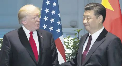  ??  ?? President Trump (L) and Chinese President Xi are scheduled to meet for the third time in Chinese capital on Nov. 8 to discuss economic ties.