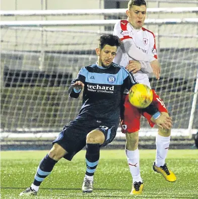  ?? Picture: Dougie Nicolson. ?? Forfar’s Dylan Easton keeps Ross Matthews of Raith at bay. Now the Loons are looking for a repeat of the team performanc­e against Ayr United.