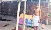  ?? HT PHOTO ?? Manish Kumar, son of the deceased, stands by the side of the grave of his mother buried in the house