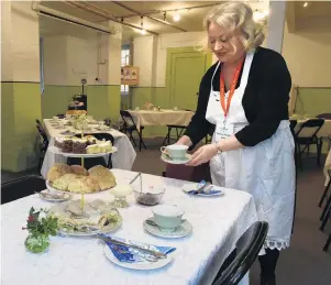  ?? PHOTOS: GREGOR RICHARDSON ?? Olveston Historic Home guide Viv Houston serves an afternoon tea in the drying room.