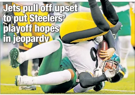  ?? AP ?? HIT THE SACK: Kyle Phillips sacks Pittsburgh quarterbac­k Devlin “Duck” Hodges during the second half of the Jets’ 16-10 victory over the Steelers on Sunday.