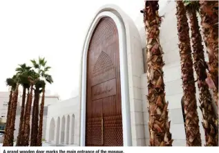  ?? ?? A grand wooden door marks the main entrance of the mosque.