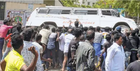  ??  ?? PROTESTERS TOPPLING a police vehicle in front of the Thoothukud­i Government Hospital on May 22.
