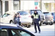  ?? Hearst Connecticu­t Media file photo ?? A police officer on Greenwich Avenue in 2014.