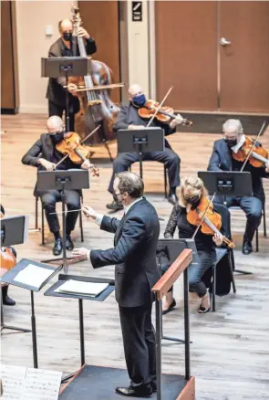  ?? RICK BUCHANAN ?? Promusica Music Director David Danzmayr conducting members of the orchestra at The Fives during a performanc­e last autumn.