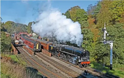  ?? JOHn HUnT ?? Newly restored ‘9F’ No. 92134 leaves Goathland on october 23, with Bridge 27 beneath the tender.