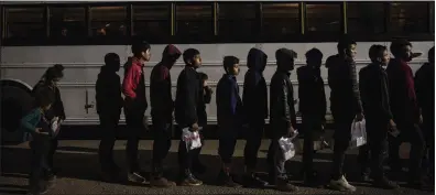  ?? PHOTOS BY KIRSTEN LUCE THE NEW YORK TIMES ?? Children are processed by the U.S. Border Patrol in Roma, Texas, in May 2022. In the past two years alone, 250,000 unaccompan­ied minors have come into the country.