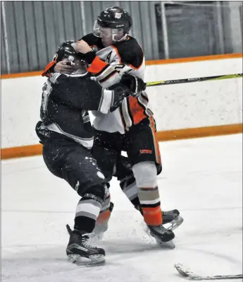  ?? File photo ?? The Coaldale Copperhead­s are back at it as they are holding training cam in anticipati­on of Heritage Junior B Hockey League season. Part of it will be renewing hostilitie­s with rival Medicine Hat Cubs. Here back in 2019 playoffs, Coaldale defenceman Mitchell Konschuk comes to the aid of goalie Nolan Berner who got heavily bodychecke­d and had his mask sent flying by Cubs’ Tavin Stadnicki (above).