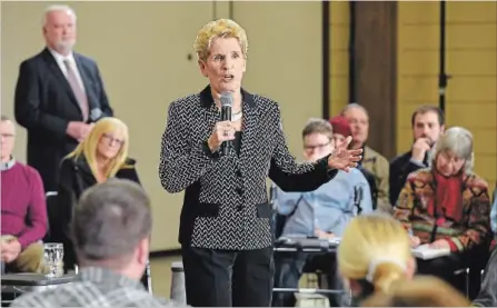  ?? JOHN RENNISON THE HAMILTON SPECTATOR ?? Premier Kathleen Wynne answers questions at a town hall meeting at the Ancaster fair grounds before a crowd of 175 people.