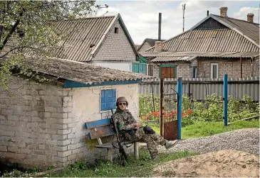  ?? GETTY IMAGES ?? A Ukrainian soldier rests in a frontline village near Velyka Novosilka in Ukraine’s Donetsk Oblast. Russia has stepped up its attacks in southeast Ukraine as it tries to advance further into the Donetsk and Zaporizhzh­ia regions.