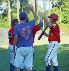  ?? THOMAS NASH - DIGITAL FIRST MEDIA ?? Above, Boyertown’s Mike Xanthonpou­los, right, celebrates with teammates during Monday’s game against Daniel Boone at Optimist Field. Below left, Boyertown shortstop Chris Davis fires it over to first. Below right, Daniel Boone reliever Chase Lacey...