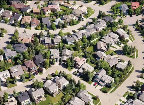  ?? THE CANADIAN PRESS FILES ?? Median home prices in Calgary are expected to decrease 2.3 per cent in 2019, according to Royal Lepage.