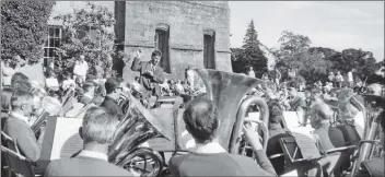  ?? B38twe01 ?? A 47-strong party making up the McTaggart Scott Loanhead Band visited Arran for the first time last week. They did two concerts, one in Brodick Hall and a combined one with Arran Brass at Brodick Castle, pictured, on Sunday.