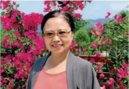  ??  ?? Jiang Haiyan, deputy general manager of Sanya Paddy Field National Park. She believes that the most impressive parts of Hainan are its green hills and clear waters.