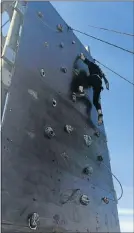  ?? Pictures: GILLIAN McAINSH ?? SPIDER-GIRL: Megan Minnaar grapples her way to the top of the climbing wall