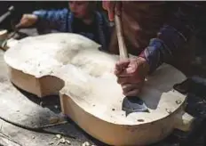  ?? AFP ?? Mateusz Raszewski works on a kalisz bass, considered a distant cousin of Renaissanc­e and Baroque-era bass viols.