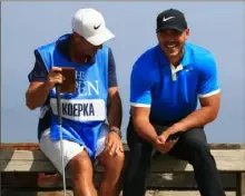  ?? Mike Ehrmann/ Getty Images ?? Caddie Ricky Elliott, left, might be Brooks Koepka’s secret weapon this weekend at Royal Portrush.