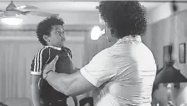  ?? PROVIDED BY MARK TAYLOR/ NBC ?? Andre the Giant ( Matthew Willig) lifts Dwayne Johnson ( Adrian Groulx) in the premiere episode of “Young Rock.”