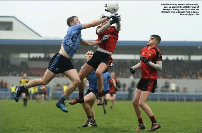  ??  ?? John Mark Foley, Kenmare Shamrocks, goes up against Brian McDermott of Westport during the All-Ireland Club IFC semi-final at Cusack Park in Ennis. Photo by Sportsfile