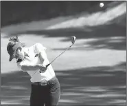  ?? NWA Democrat-Gazette/J.T. WAMPLER ?? ABOVE Kaylee Benton of Arkansas hits an approach shot on the ninth hole during the second round of the NCAA women’s golf championsh­ip Sunday at the Blessings Golf Club in Fayettevil­le. BELOW Brooke Matthews of Arkansas reacts after holing out a chip shot on the ninth hole.