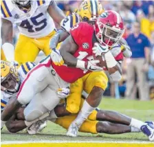  ?? STEVEN LIMENTANI/GEORGIA PHOTO ?? Georgia junior running back Elijah Holyfield scores on a 10-yard run late in the third quarter of Saturday’s 36-16 loss to LSU. The Bulldogs are off next weekend before taking on Florida in Jacksonvil­le on Oct. 27.