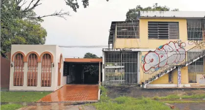  ?? Buildings in Puerto Rico — such as this one in Guaynabo — were abandoned during years of financial crisis.
RICARDO ARDUENGO, AP ??