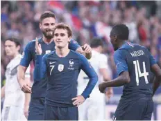  ?? — AFP ?? France’s Antoine Griezmann (C) celebrates after scoring their second goal on a penalty kick during the UEFA Nations League match against Germany at the Stade de France in Saint-denis, near Paris.