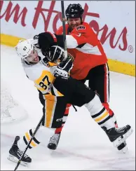  ?? THE CANADIAN PRESS/SEAN KILPATRICK ?? Pittsburgh Penguins centre Sidney Crosby (87) battles with Ottawa Senators defenceman Marc Methot (3) during the second period of Game 6 of the Eastern Conference final in Ottawa on Tuesday.