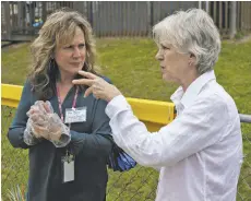  ?? PHOTOS BY LUKE CHRISTOPHE­R ?? Above, right: RCPS’s Jenny Kapsa, talking with Jane Bowling-Wilson, serves up water and cupcakes following the ceremony.