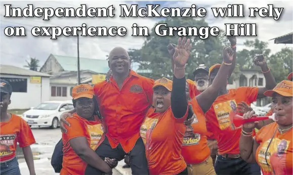  ?? (Photos: Kimberley Peddie) ?? People’s National Party candidate for the Grange Hill Division Warren Lyttleton being lifted by his supporters outside the nomination centre in Grange Hill on Thursday.