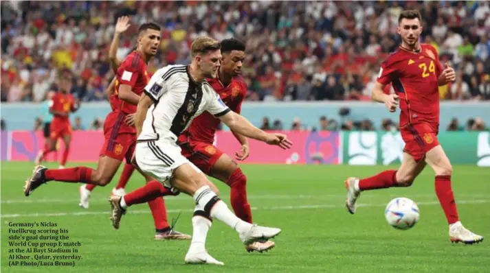  ?? ?? Germany's Niclas Fuellkrug scoring his side's goal during the World Cup group E match at the Al Bayt Stadium in Al Khor , Qatar, yesterday. (AP Photo/Luca Bruno)