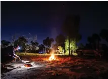  ??  ?? You can refuel at Walungurru Community store (above). A star-lit night, and dinner cooked over an open fire (below) is a big part of the outback touring experience.