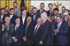  ?? Associated Press ?? HONORED — Dodgers manager Dave Roberts, third from bottom left, reacts as President Joe Biden arrives to an event to honor the 2020 World Series champion Dodgers at the White House on Friday in Washington.