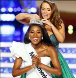  ?? NOAH K. MURRAY — THE ASSOCIATED PRESS ?? Miss New York Nia Franklin reacts after being named Miss America 2019, as she is crowned by last year’s winner Cara Mund, Sunday in Atlantic City, N.J.