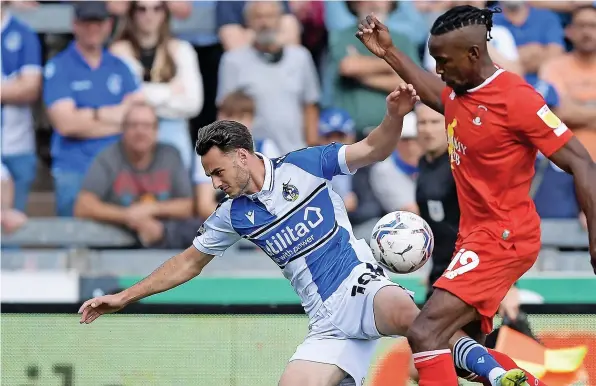  ??  ?? Bristol Rovers forward Aaron Collins takes a tumble under a challenge from Leyton Orient’s Omar Beckles