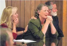  ?? ADOLPHE PIERRE-LOUIS/JOURNAL ?? Terri Gilbert reacts after a jury finds her not guilty in 1998 of murdering her husband, Bernalillo County Commission­er Gene Gilbert. Charles Daniels, right, and Randi McGinn, left, were her defense attorneys in the high-profile trial.