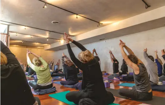  ??  ?? Yin Yoga class at YOGASOURCE at San Mateo location with instructor Melissa Spamer.