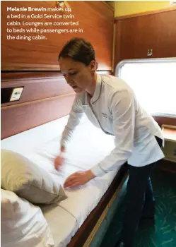  ??  ?? Melanie Brewin makes up a bed in a Gold Service twin cabin. Lounges are converted to beds while passengers are in the dining cabin.
