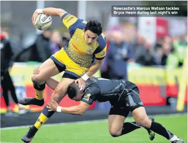  ??  ?? Newcastle’s Marcus Watson tackles Bryce Heem during last night’s win