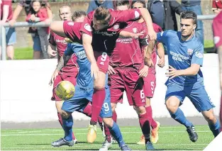  ??  ?? Arbroath’s Steven Doris takes off in this effort to get the ball.