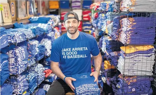  ?? BRIAN CASSELLA/CHICAGO TRIBUNE ?? Joe Johnson, the founder of Obvious Shirts, in the basement storeroom at his Wrigleyvil­le home on May 5.