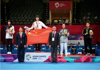  ?? Cnsphoto ?? 21 de agosto de 2018. Luo Zongshi gana la primera medalla de oro del equipo chino en combate femenino de taekwondo en la categoría de hasta 57 kg.
