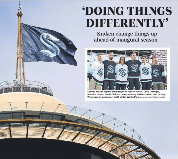  ?? ELAINE THOMPSON/ AP KAREN DUCEY/ GETTY IMAGES ?? Seattle Kraken expansion draft picks Jordan Eberle, Chris Driedger, Brandon Tanev, Jamie Oleksiak, Haydn Fleury and Mark Giordano during Wednesday’s expansion draft at Gas Works Park.
A flag with the new logo for the Kraken, the newest NHL team, flies atop the iconic Space Needle in Seattle.